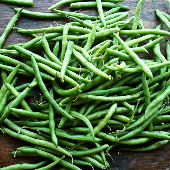 a bunch of strings beans on table