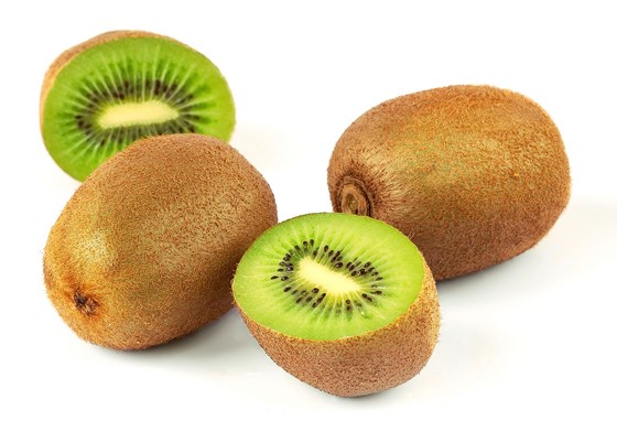kiwi fruits on a white surface