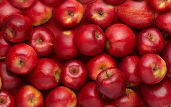 a bunch of red sweet american apples