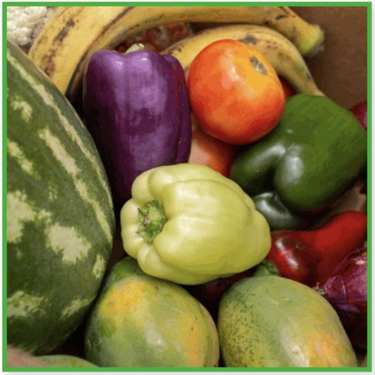 a box with assorted fruits and vegetables