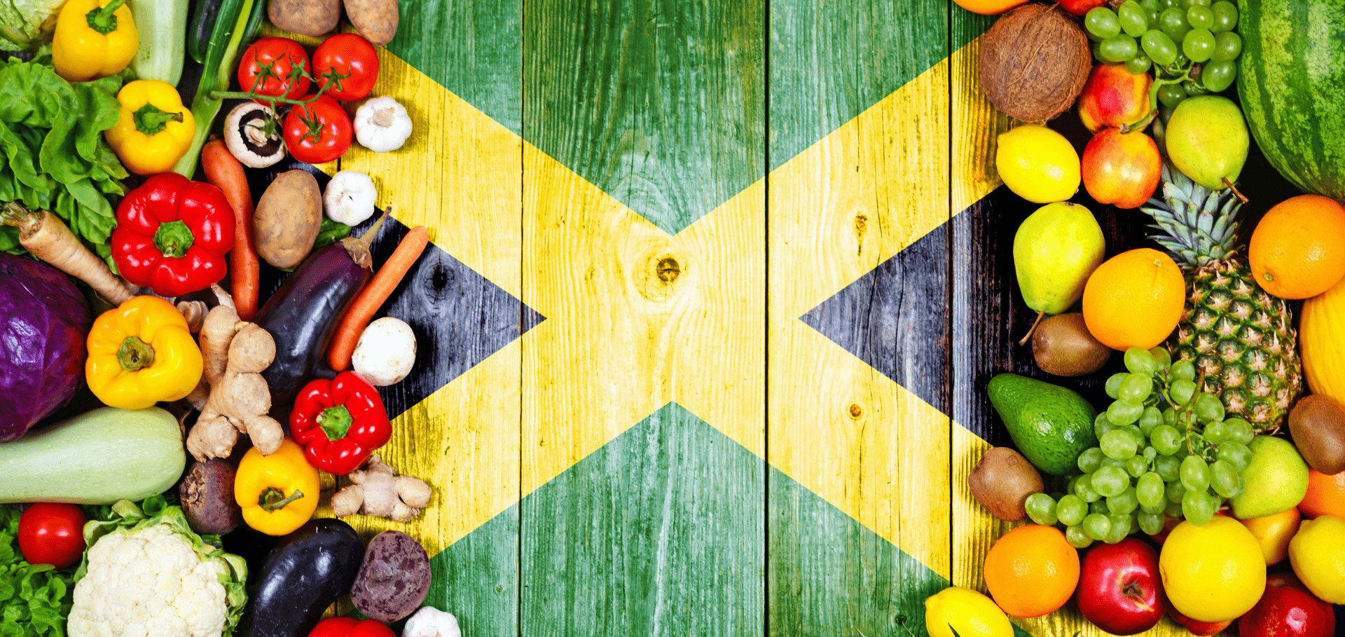 Jamaica flag background with fresh fruits and veggies on either side